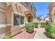 Charming front entrance with manicured bushes and walkway at 1554 Ward Frontier Ln, Henderson, NV 89002