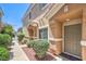 Townhome front entrance with landscaped yard at 1554 Ward Frontier Ln, Henderson, NV 89002