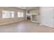 Living room features a fireplace, ceiling fan, and neutral color palette at 1554 Ward Frontier Ln, Henderson, NV 89002