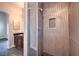 Stylish shower with patterned tile, glass door and a recessed shelf at 1554 Ward Frontier Ln, Henderson, NV 89002