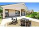 Inviting backyard patio with seating and fire pit, landscaped garden, and covered porch for outdoor relaxation at 2164 Noonday Ct, Henderson, NV 89052