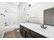 Bathroom with single vanity, tub with shower, and tiled floor at 2164 Noonday Ct, Henderson, NV 89052