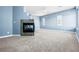 Spacious bedroom boasting a fireplace, bay window, neutral carpet, and blue walls at 2164 Noonday Ct, Henderson, NV 89052