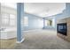 A spacious bedroom with a fireplace, tub, and multiple windows at 2164 Noonday Ct, Henderson, NV 89052