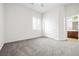 Bedroom with carpet, window with plantation shutters and access to bathroom at 2164 Noonday Ct, Henderson, NV 89052