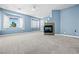 Spacious bedroom boasts a fireplace, bay window, neutral carpet, and blue walls at 2164 Noonday Ct, Henderson, NV 89052
