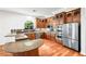 Well-lit kitchen with stainless steel appliances, wooden cabinets and granite countertops at 2164 Noonday Ct, Henderson, NV 89052