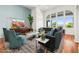Staged living room features bright decor and a large arch window with a mountain view at 2164 Noonday Ct, Henderson, NV 89052