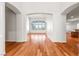 Spacious living room with hardwood floors, arched doorways, and natural light at 2164 Noonday Ct, Henderson, NV 89052