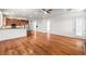 Spacious living room with hardwood floors, bright windows, and an open kitchen at 2164 Noonday Ct, Henderson, NV 89052