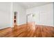 Bright, open room with hardwood floors and arched doorways to the foyer at 2164 Noonday Ct, Henderson, NV 89052