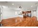 Open-concept living space with hardwood floors and kitchen with stainless steel appliances at 2164 Noonday Ct, Henderson, NV 89052