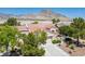 Beautiful aerial view of a single-story home with a red tile roof and mountain views in the distance at 2315 Sun Cliffs St, Las Vegas, NV 89134