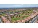 Expansive aerial view of the community with lush golf courses, desert landscapes, and distant mountain views at 2315 Sun Cliffs St, Las Vegas, NV 89134