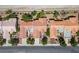 An aerial view shows a row of homes with red tiled roofs and well-manicured landscaping at 2315 Sun Cliffs St, Las Vegas, NV 89134