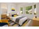 Bright bedroom with large windows, stylish decor, and adjacent bathroom access at 2315 Sun Cliffs St, Las Vegas, NV 89134