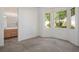 Bright bedroom featuring a window and an ensuite bathroom at 2315 Sun Cliffs St, Las Vegas, NV 89134