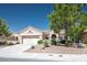 Charming single-story home with a well-manicured front yard and a two-car garage at 2315 Sun Cliffs St, Las Vegas, NV 89134