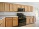 Bright kitchen featuring stainless steel appliances, light wood cabinetry, and ample counter space at 2315 Sun Cliffs St, Las Vegas, NV 89134