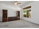 Spacious living area with neutral carpet, built-in shelves and cabinets, and natural light at 2315 Sun Cliffs St, Las Vegas, NV 89134