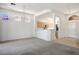 Spacious living room with tile and carpet flooring, offering an open-concept layout to the kitchen at 2315 Sun Cliffs St, Las Vegas, NV 89134