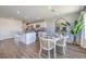 Open-concept dining area next to the kitchen features a bright atmosphere with stylish decor at 2642 Begonia Falls Ave # 40, North Las Vegas, NV 89081