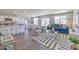 Open-concept living room featuring modern decor, hardwood floors, and lots of natural light at 2642 Begonia Falls Ave # 40, North Las Vegas, NV 89081