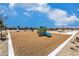 Community playground with blue slides, monkey bars, and soft ground for safe and fun play at 2642 Begonia Falls Ave # 40, North Las Vegas, NV 89081