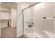 This bathroom features a glass-enclosed shower with tiled walls and a view to a walk-in closet at 2646 Begonia Falls Ave # 41, North Las Vegas, NV 89081