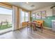 Sunlit dining area with sliding doors to outdoor space and stylish modern decor at 2646 Begonia Falls Ave # 41, North Las Vegas, NV 89081