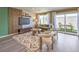Well-lit living room with a modern media wall and sliding door access to the backyard at 2646 Begonia Falls Ave # 41, North Las Vegas, NV 89081