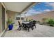 Outdoor dining and lounging on a spacious covered patio with garden views at 2651 Deep Canyon St, Henderson, NV 89044