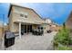 Expansive backyard featuring a patio, dining area, grilling station, and well-manicured garden at 2651 Deep Canyon St, Henderson, NV 89044