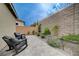Paver patio with landscaping and lounge chairs offers a relaxing outdoor space at 2651 Deep Canyon St, Henderson, NV 89044