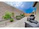 Backyard patio featuring pavers, tasteful landscaping, and comfortable seating, perfect for relaxation at 2651 Deep Canyon St, Henderson, NV 89044