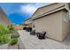 Spacious backyard with paver patio, lush landscaping, and outdoor seating perfect for entertaining at 2651 Deep Canyon St, Henderson, NV 89044