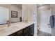 Bright bathroom featuring dual sinks, a spacious countertop, and a shower-over-tub with white tile at 2651 Deep Canyon St, Henderson, NV 89044