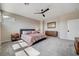 Bright bedroom showcasing a queen-size bed, ceiling fan, and gray carpeting at 2651 Deep Canyon St, Henderson, NV 89044