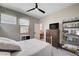 Cozy bedroom with a queen size bed, gray bedding, and a ceiling fan at 2651 Deep Canyon St, Henderson, NV 89044