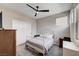 Bedroom showcasing a white metal frame bed and dual windows for natural lighting at 2651 Deep Canyon St, Henderson, NV 89044