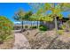 Community overlook signage surrounded by mature trees and landscaping leading to a scenic view, enhancing the outdoor experience at 2651 Deep Canyon St, Henderson, NV 89044