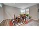 Dining room with modern rug, natural light, and seating for four, great for Gathering meals at 2651 Deep Canyon St, Henderson, NV 89044