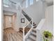 Inviting entryway featuring a staircase, white door with sidelights, and bench at 2651 Deep Canyon St, Henderson, NV 89044