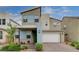 Modern two-story home featuring a colorful exterior, well-manicured lawn and two car garage at 2651 Deep Canyon St, Henderson, NV 89044