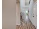 Bright foyer with wood floors, a staircase with iron railings, and an open view to the living spaces at 2651 Deep Canyon St, Henderson, NV 89044