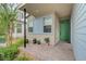 Charming front porch with a green door, brick pathway, and landscaped garden, enhancing curb appeal at 2651 Deep Canyon St, Henderson, NV 89044