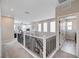 Upstairs hallway featuring neutral colored walls, plush carpet, and modern railings at 2651 Deep Canyon St, Henderson, NV 89044