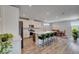 Stylish kitchen with stainless appliances, a center island with seating, and dining area at 2651 Deep Canyon St, Henderson, NV 89044