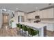 Modern kitchen featuring white cabinets, stainless steel appliances, and a large island with seating at 2651 Deep Canyon St, Henderson, NV 89044