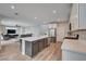 Bright, open kitchen with stainless steel appliances, a large island, and seamless flow to the living area at 2651 Deep Canyon St, Henderson, NV 89044